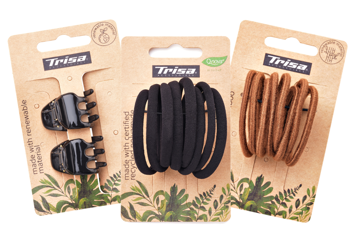 Set von drei nachhaltigen Haarschmuck Produkten, bestehend aus Recycling Haargummis Qnova und Haarklammern aus nachwachsenden Rohstoffen von Trisa Accessoires.